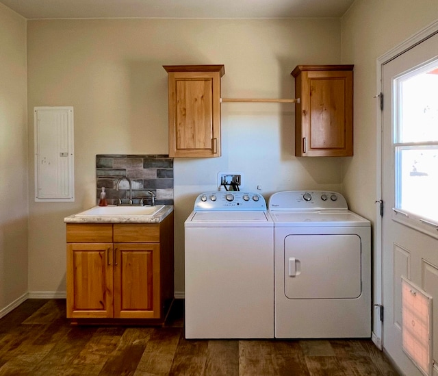 washroom featuring cabinets, dark wood-type flooring, sink, separate washer and dryer, and electric panel