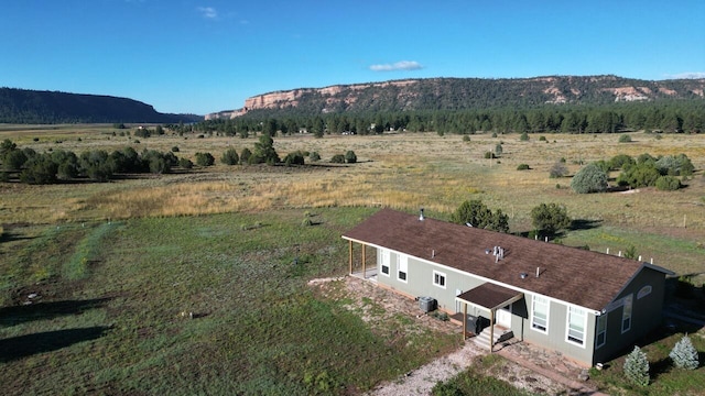 mountain view featuring a rural view