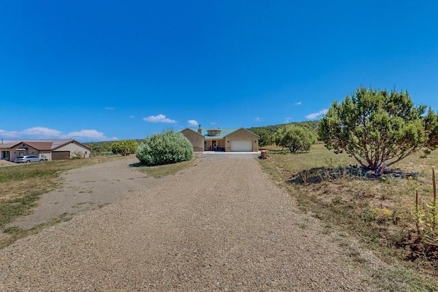 view of front of house with a detached garage