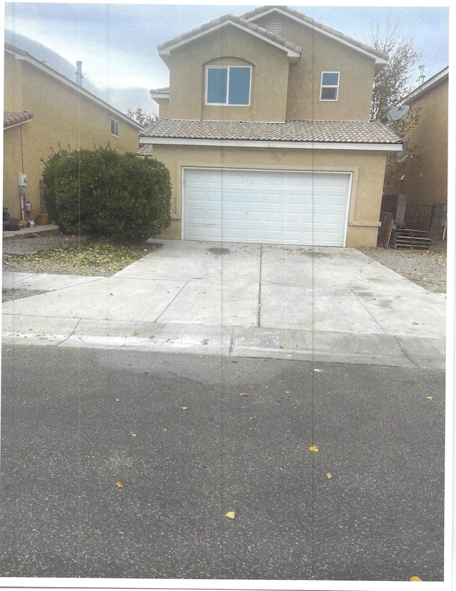 front facade with a garage