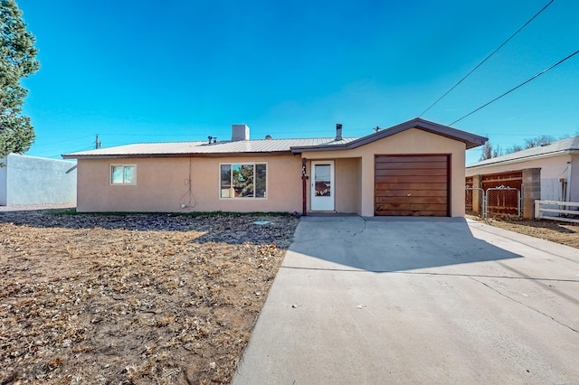 single story home featuring a garage