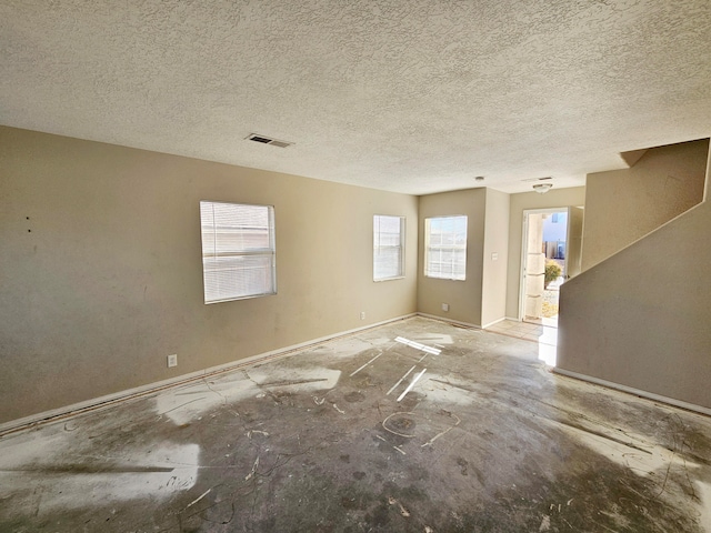 empty room with a textured ceiling