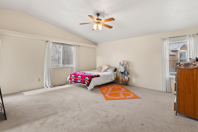 bedroom featuring ceiling fan, carpet, and vaulted ceiling