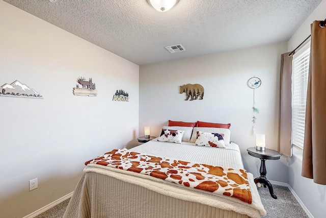 carpeted bedroom with a textured ceiling