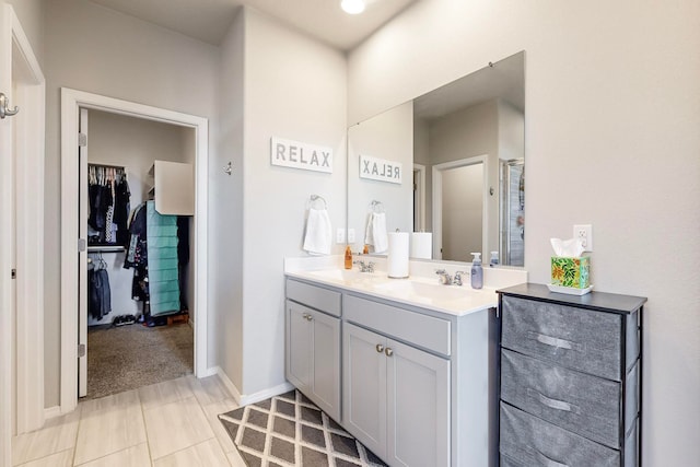 bathroom with tile patterned flooring and vanity