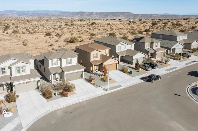 drone / aerial view featuring a mountain view