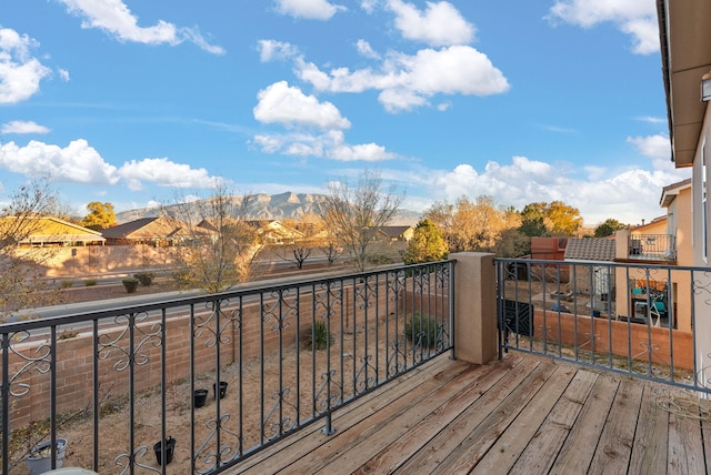 wooden deck with a mountain view