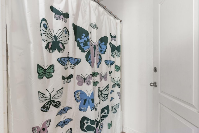 bathroom with a shower with curtain