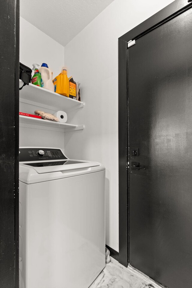 washroom featuring washer / clothes dryer