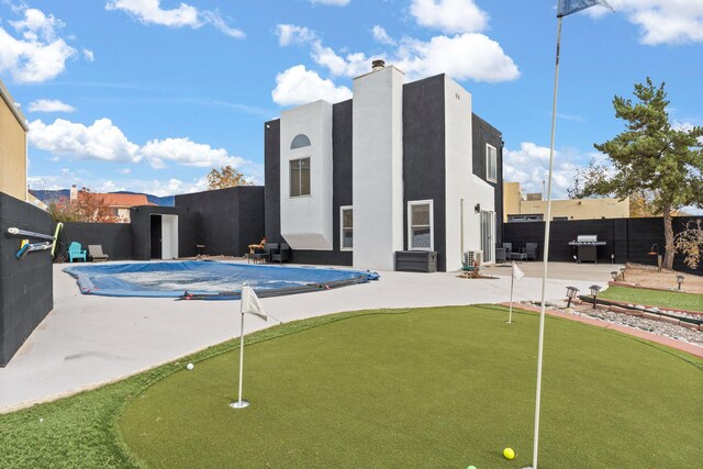 view of swimming pool with a patio