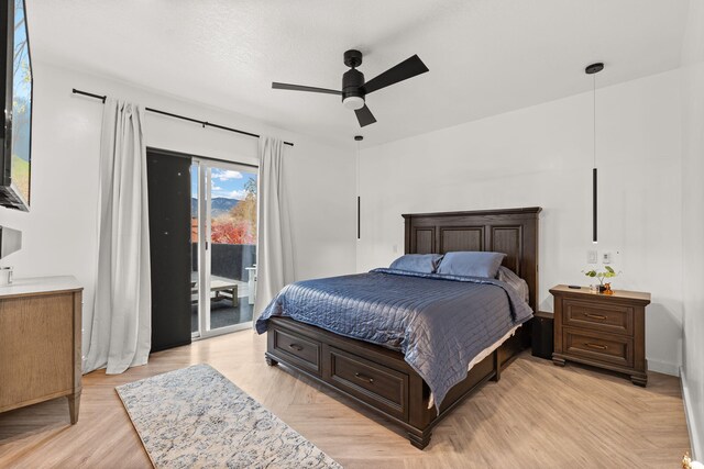 bedroom with access to exterior and ceiling fan