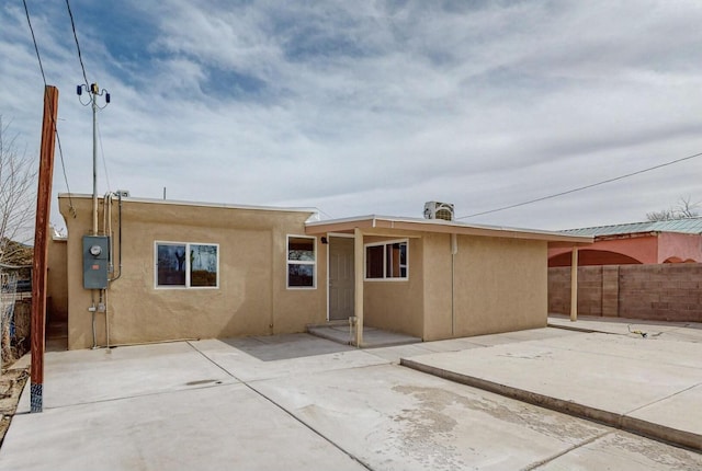 back of property with a patio area