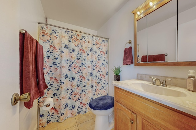 bathroom featuring toilet, vanity, and tile patterned floors