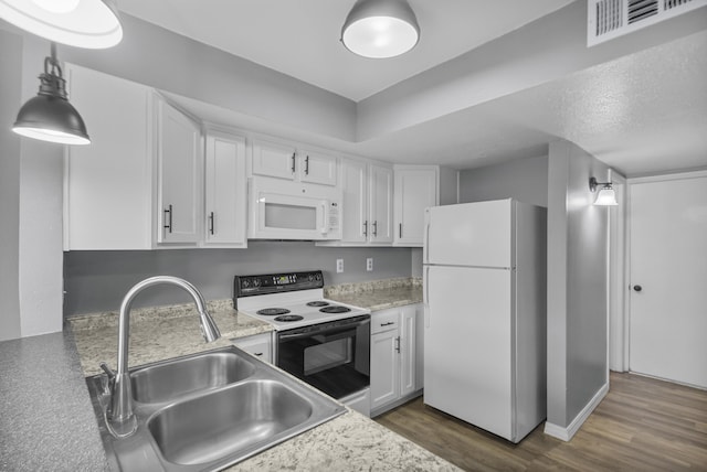 kitchen featuring white appliances, white cabinets, a textured ceiling, sink, and dark hardwood / wood-style floors