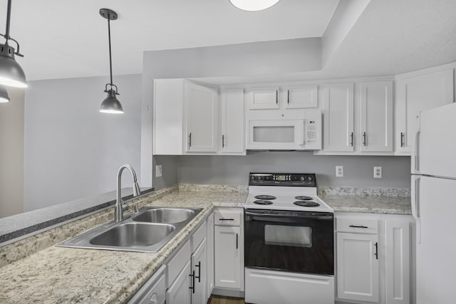 kitchen featuring hanging light fixtures, sink, white appliances, and white cabinetry