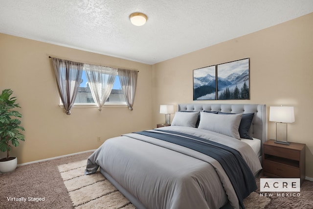 carpeted bedroom with a textured ceiling