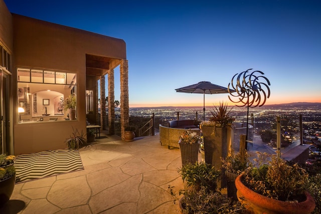 view of patio terrace at dusk