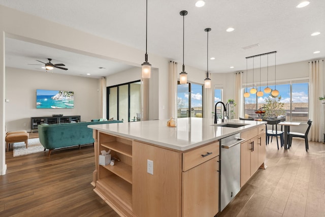 kitchen featuring light brown cabinets, sink, dark hardwood / wood-style flooring, plenty of natural light, and an island with sink