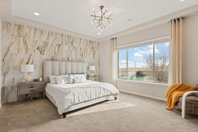 carpeted bedroom with a water view and an inviting chandelier