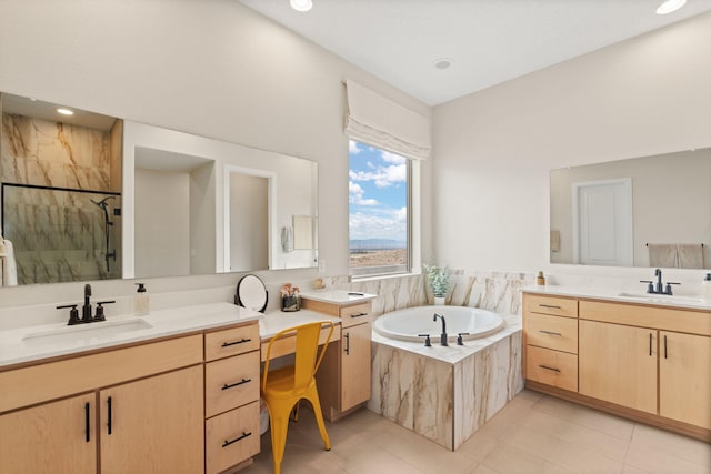 bathroom with tile patterned floors, vanity, and independent shower and bath