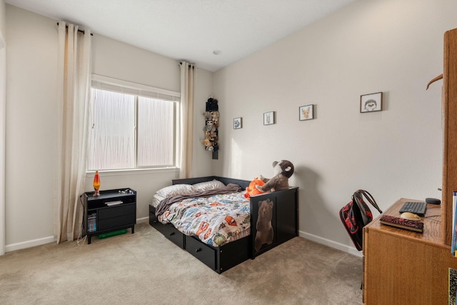 bedroom featuring light colored carpet