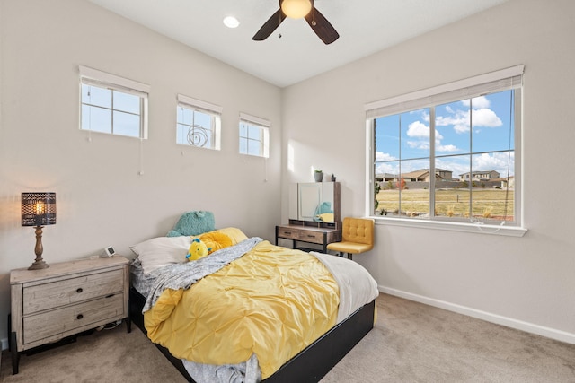 carpeted bedroom with ceiling fan