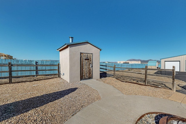 view of outbuilding featuring a water view