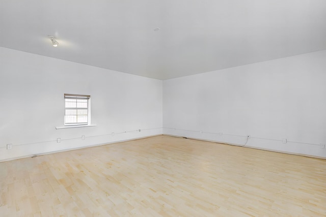 unfurnished room with light hardwood / wood-style flooring