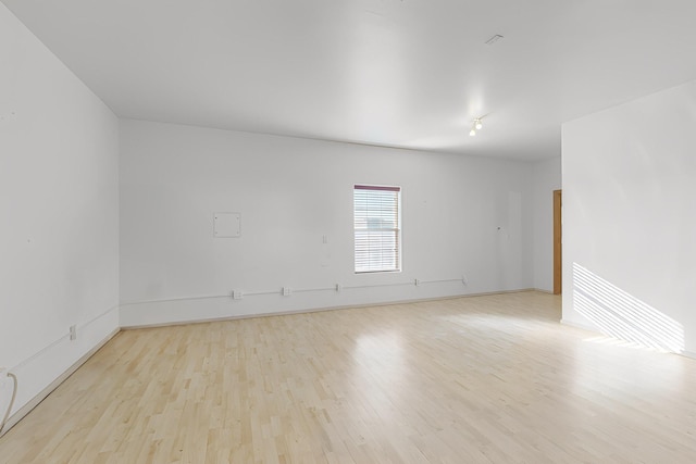 empty room with light hardwood / wood-style floors