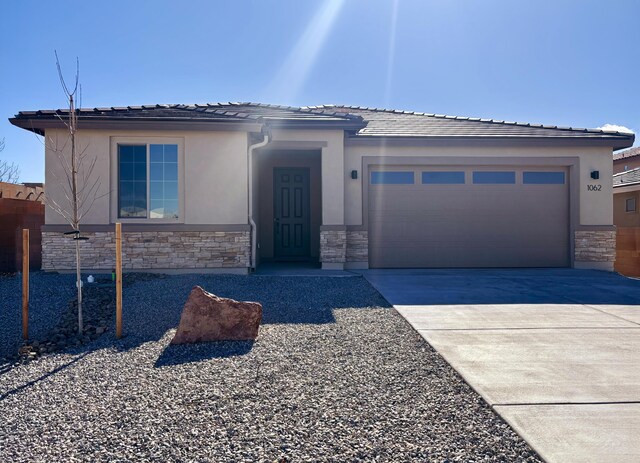 prairie-style home featuring a garage