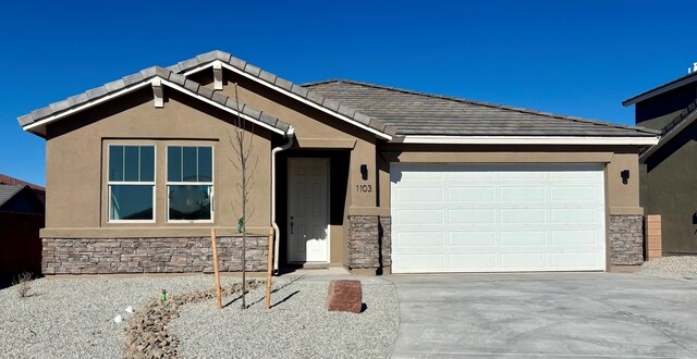 single story home featuring a garage