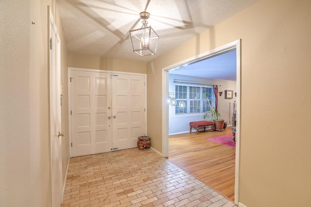 entryway with a textured ceiling