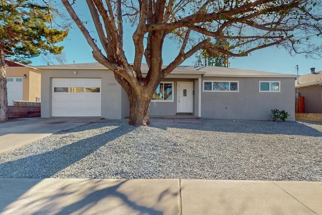 ranch-style home featuring a garage