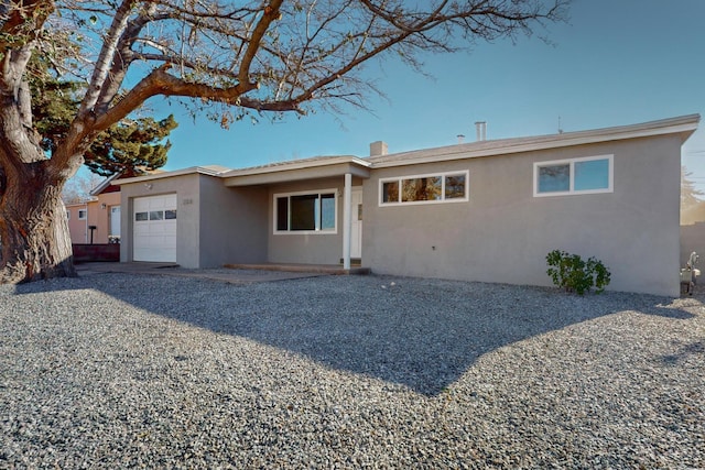 single story home with a garage