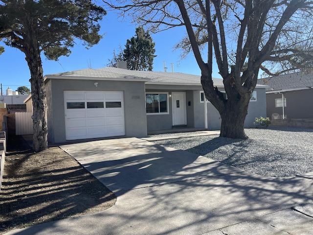 ranch-style home featuring a garage