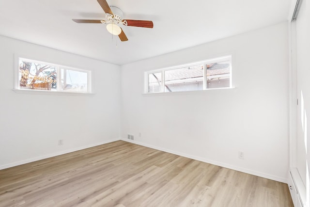 unfurnished room with ceiling fan and light wood-type flooring