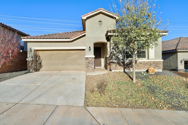 mediterranean / spanish-style home with a garage