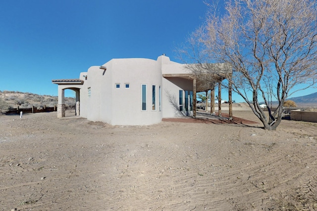 view of property exterior with stucco siding