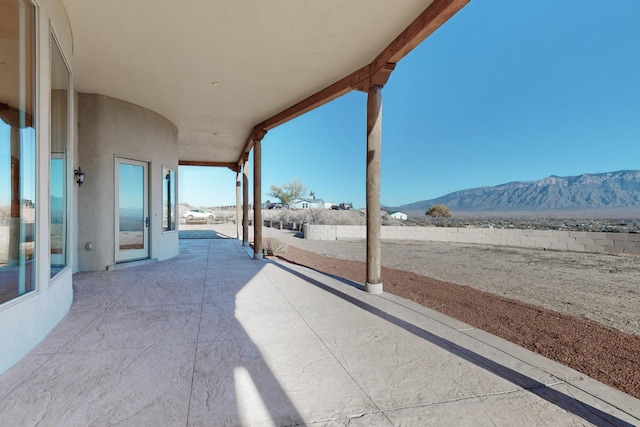 view of patio / terrace featuring a mountain view