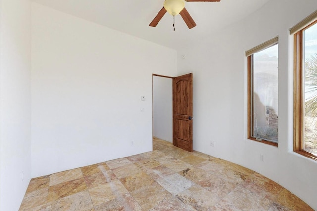 empty room featuring a ceiling fan