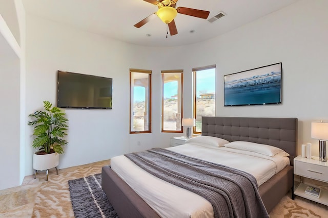 bedroom featuring ceiling fan and visible vents