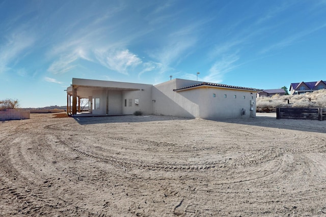 back of property with stucco siding