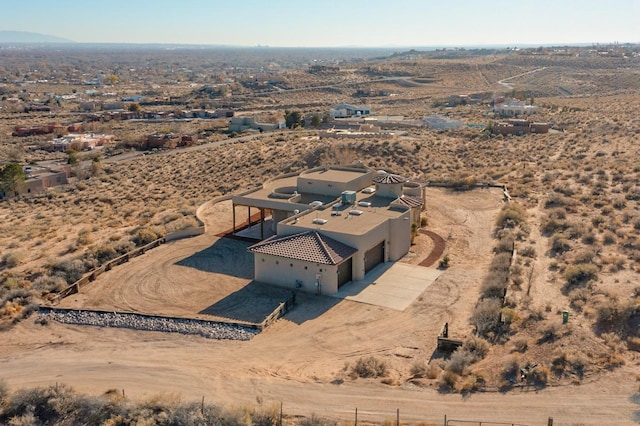 drone / aerial view featuring a desert view