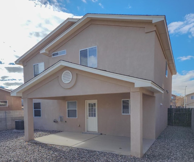 back of house featuring a patio area and central AC