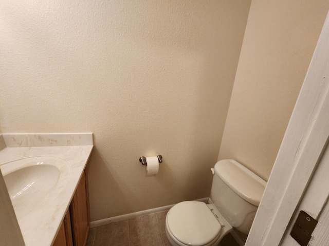 bathroom with tile patterned flooring and toilet