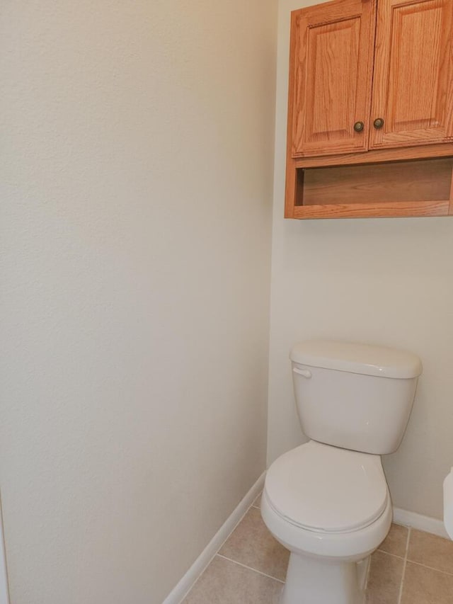 bathroom featuring tile patterned floors and toilet