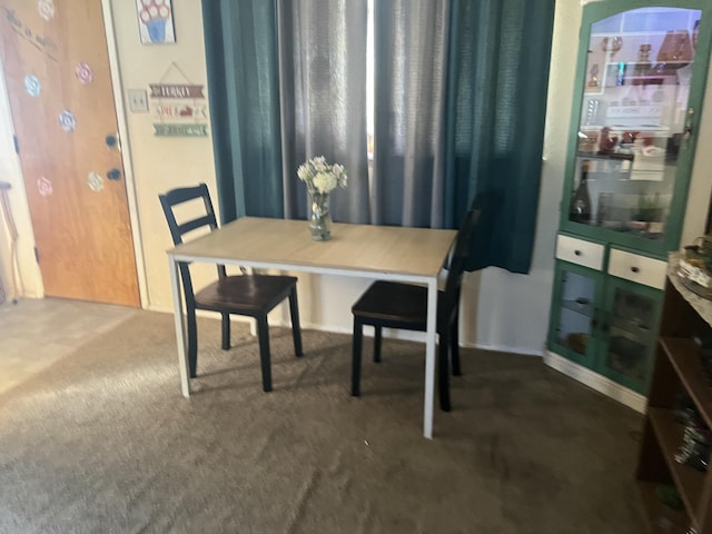 dining space with dark carpet