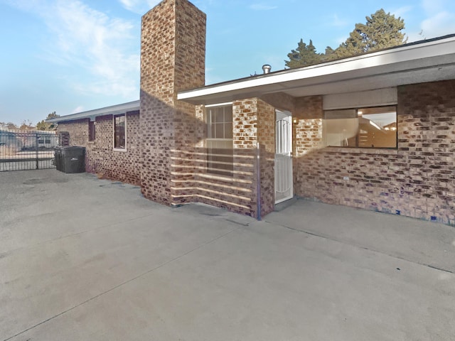 view of property exterior featuring a patio area