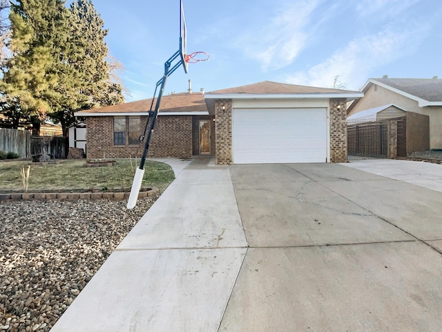 ranch-style home with a garage and a front lawn