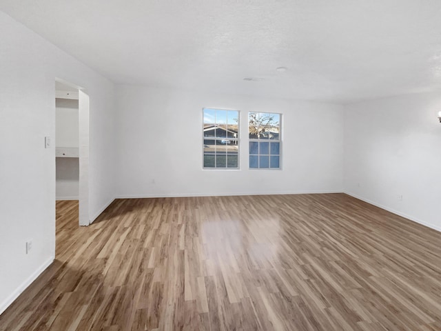 empty room featuring hardwood / wood-style flooring